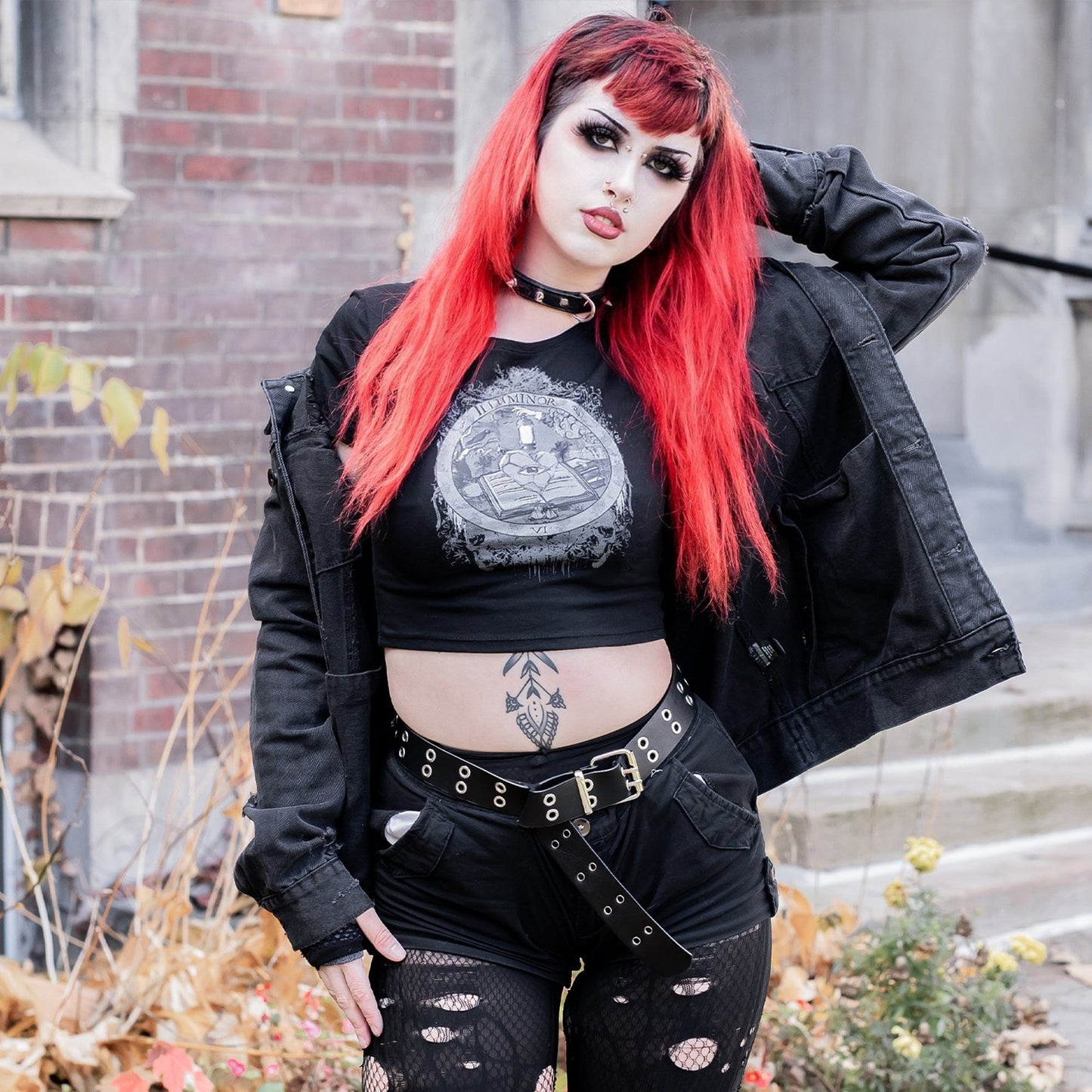 Model wearing Illuminor Graphic Crop Top in a gothic setting from Mr. Serial Killer