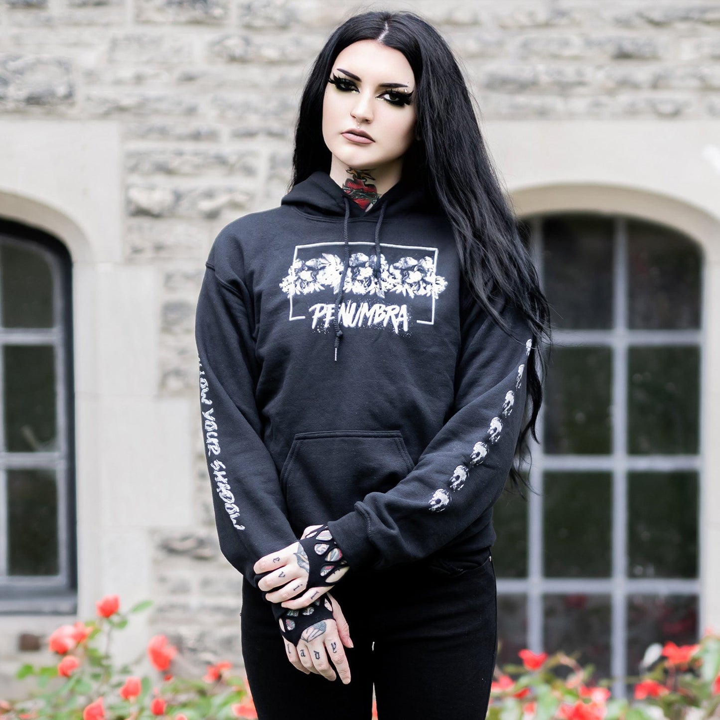 Gothic model wearing the Penumbra Black Hoodie in a Victorian setting, capturing the essence of dark macabre fashion.