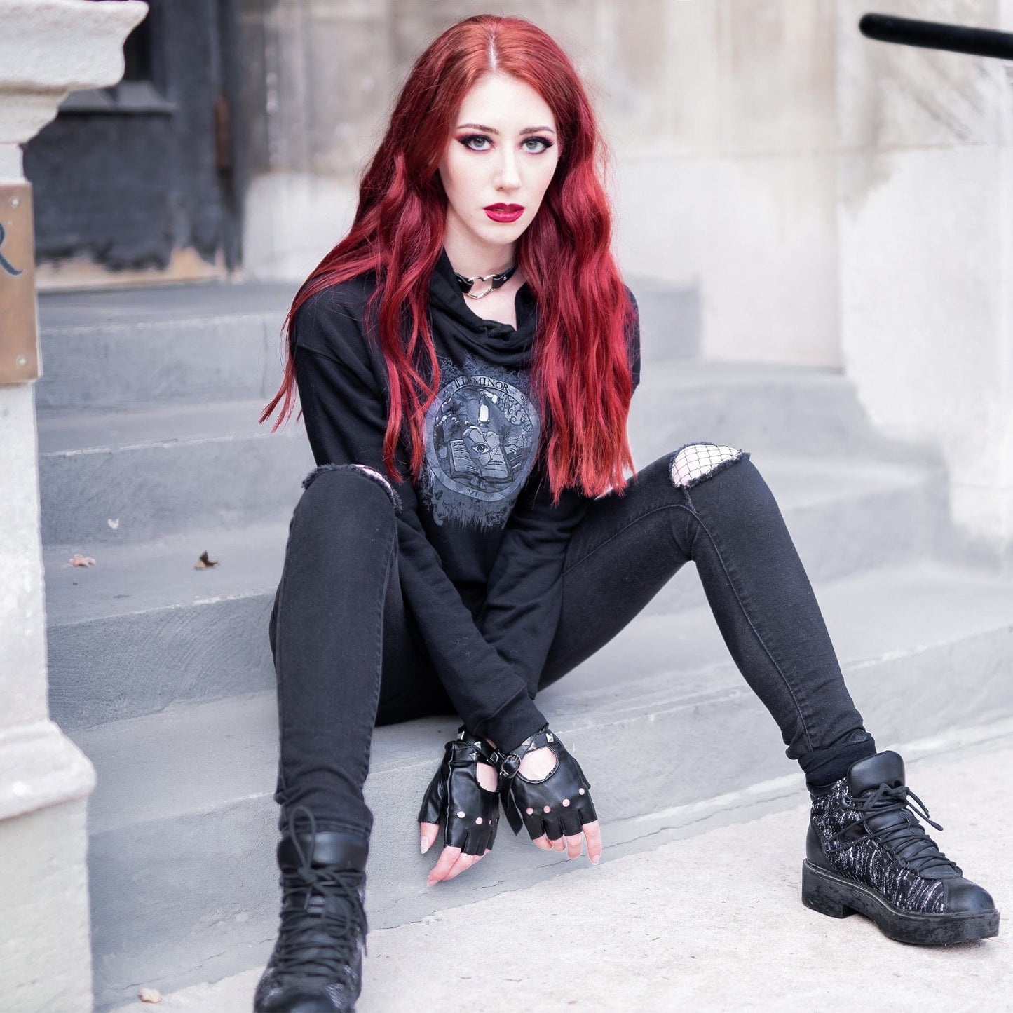 Model wearing Illuminor Crop Hoodie in a gothic setting by Mr. Serial Killer