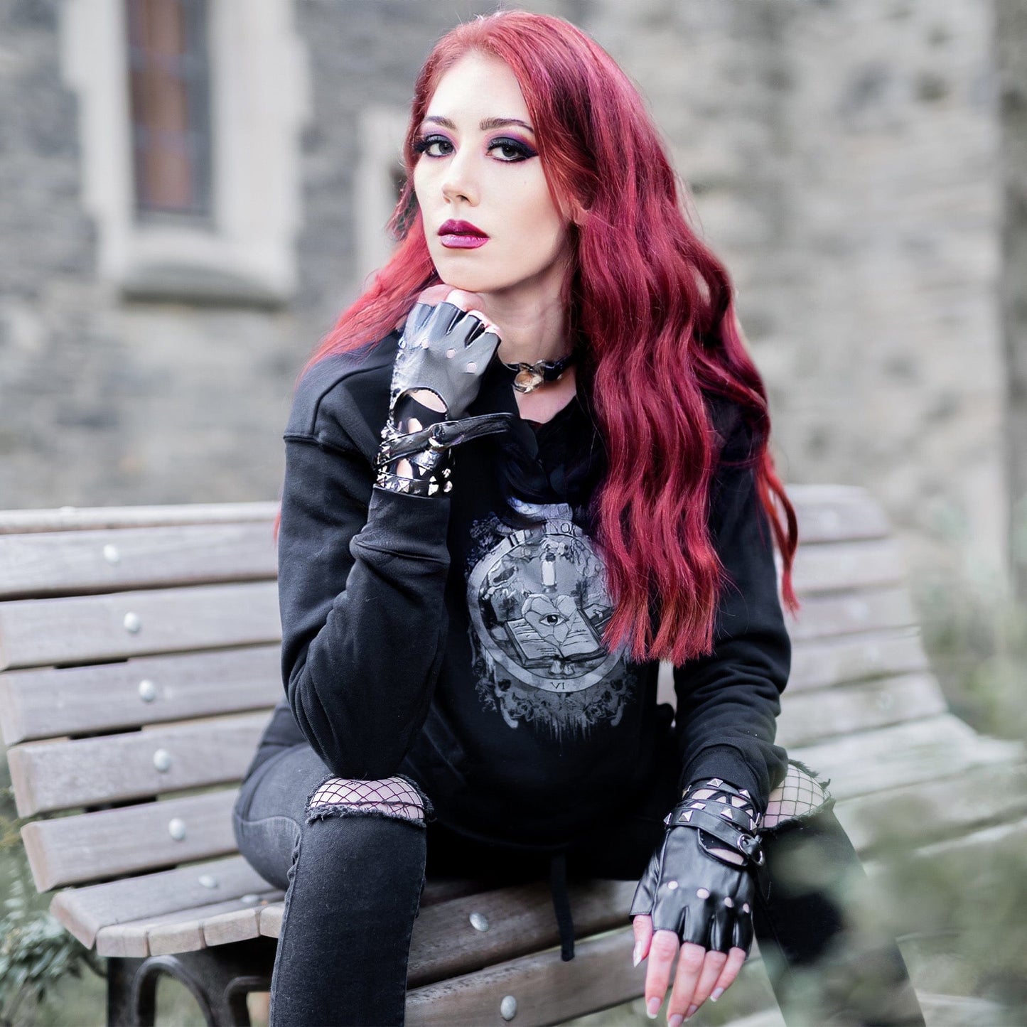 Model wearing Illuminor Crop Hoodie in a gothic setting by Mr. Serial Killer