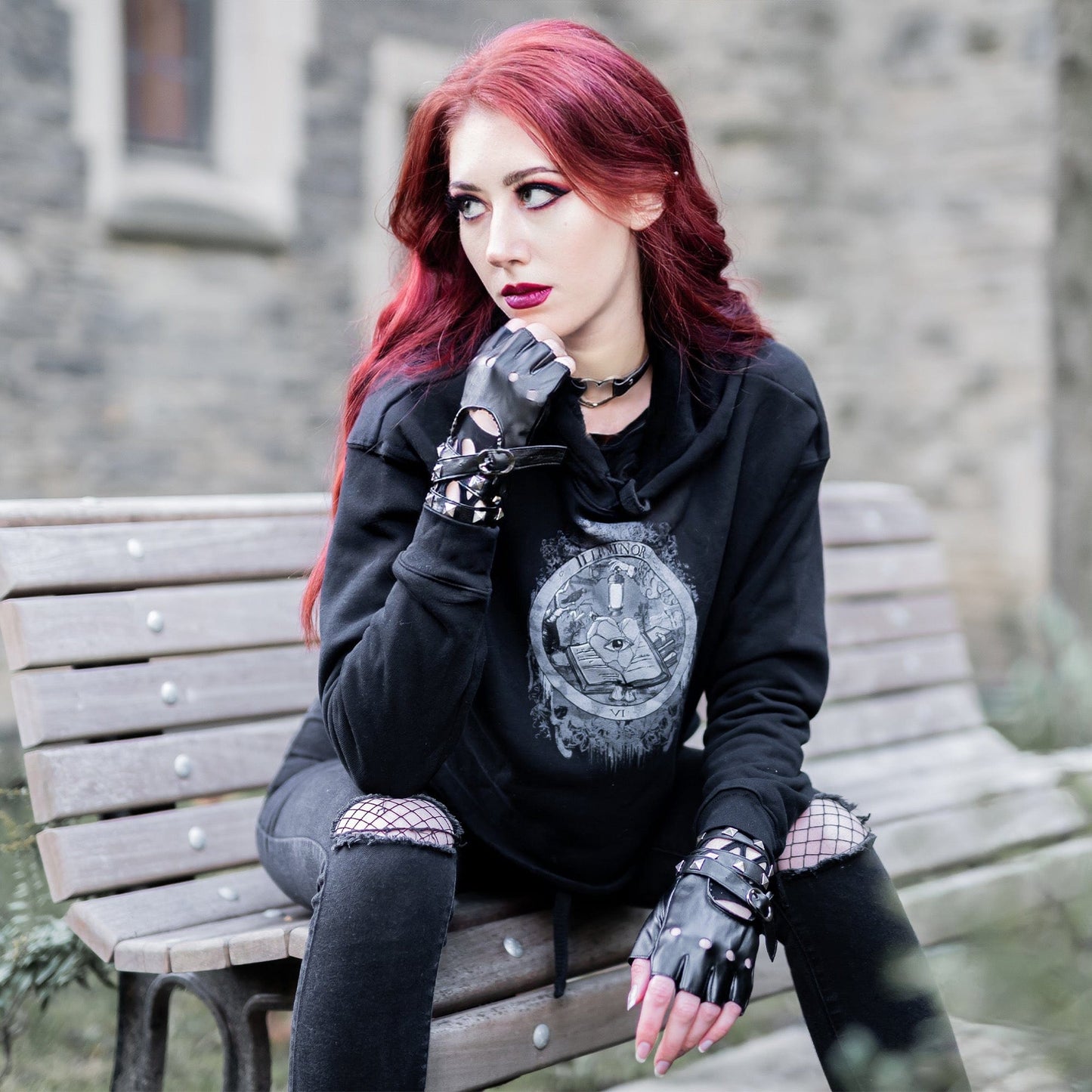 Model wearing Illuminor Crop Hoodie in a gothic setting by Mr. Serial Killer