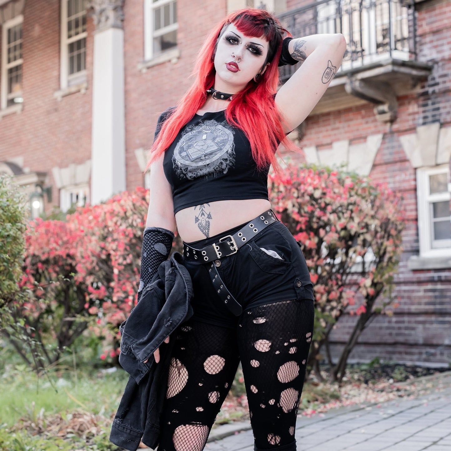 Model wearing Illuminor Graphic Crop Top in a gothic setting from Mr. Serial Killer
