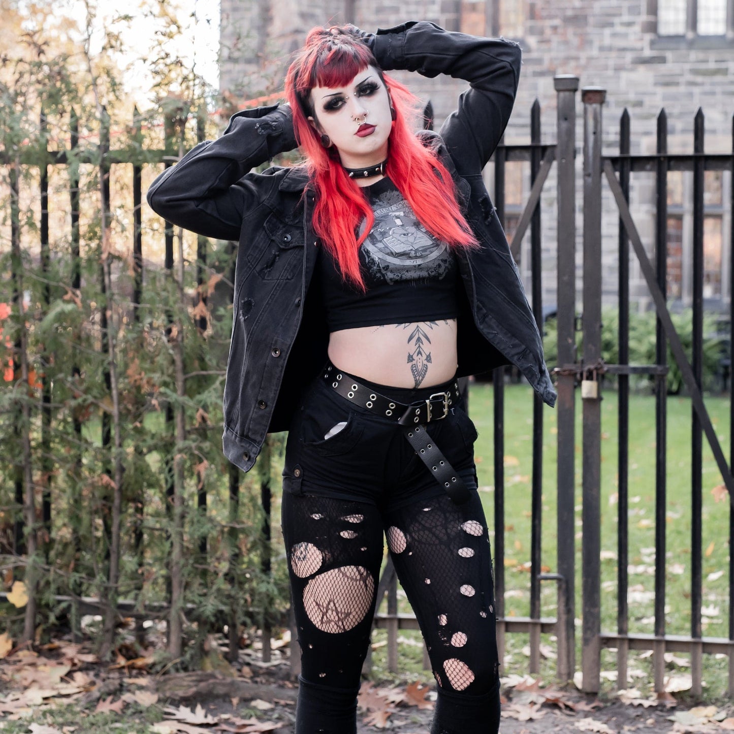 Model wearing Illuminor Graphic Crop Top in a gothic setting from Mr. Serial Killer