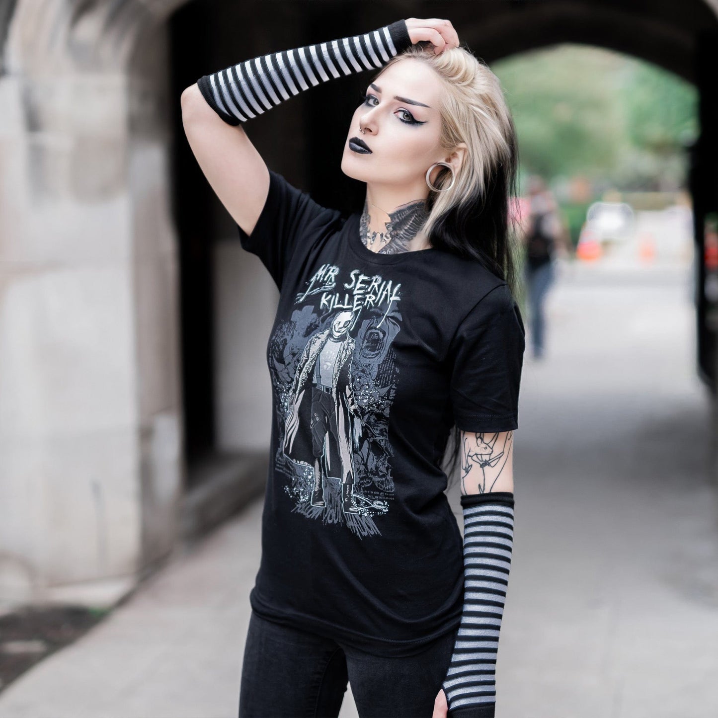 Gothic model wearing the Mr. Serial Killer Follow Your Shadow Graphic T-Shirt in a Victorian setting, capturing dark macabre fashion