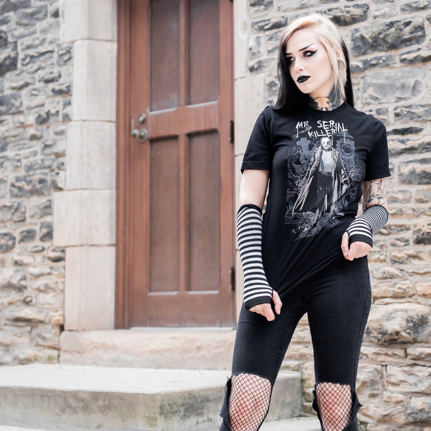Gothic model wearing the Mr. Serial Killer Follow Your Shadow Graphic T-Shirt in a Victorian setting, capturing dark macabre fashion