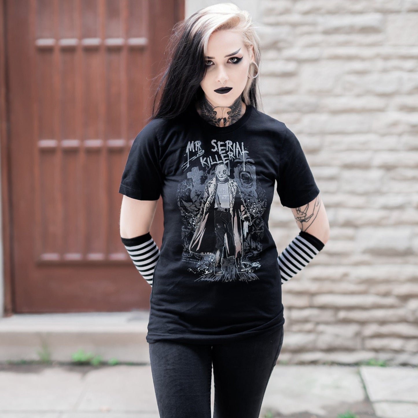 Gothic model wearing the Mr. Serial Killer Follow Your Shadow Graphic T-Shirt in a Victorian setting, capturing dark macabre fashion