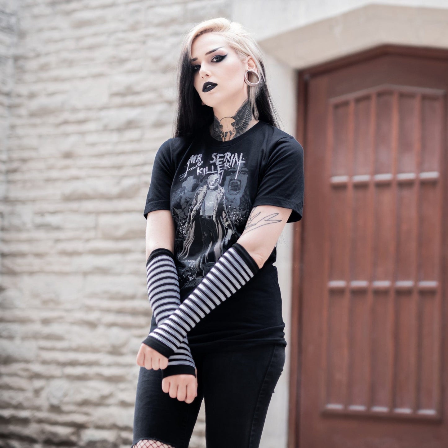 Gothic model wearing the Mr. Serial Killer Follow Your Shadow Graphic T-Shirt in a Victorian setting, capturing dark macabre fashion