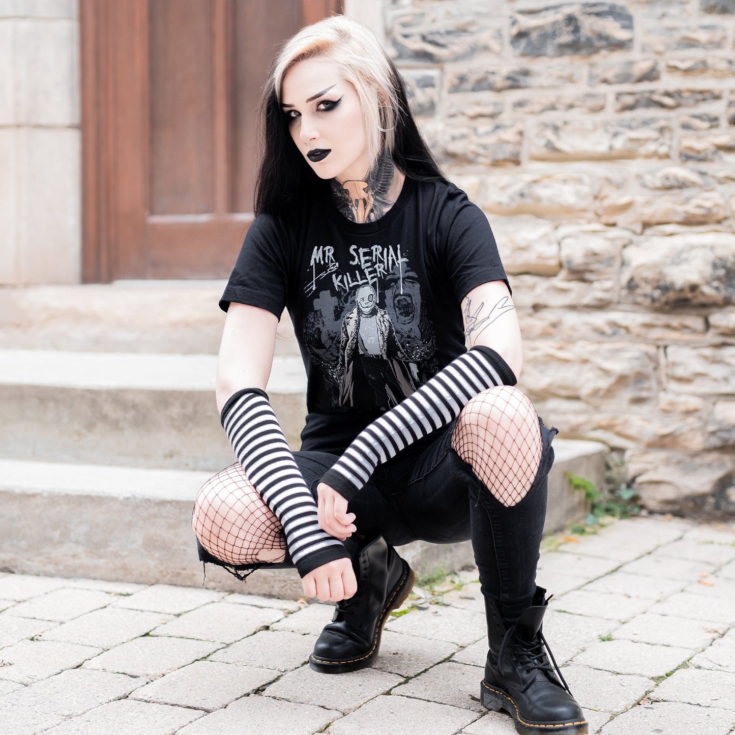 Gothic model wearing the Mr. Serial Killer Follow Your Shadow Graphic T-Shirt in a Victorian setting, capturing dark macabre fashion