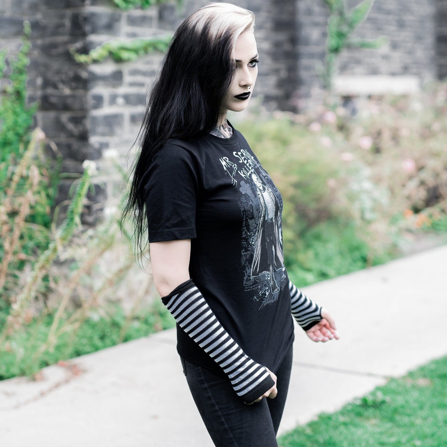 Gothic model wearing the Mr. Serial Killer Follow Your Shadow Graphic T-Shirt in a Victorian setting, capturing dark macabre fashion