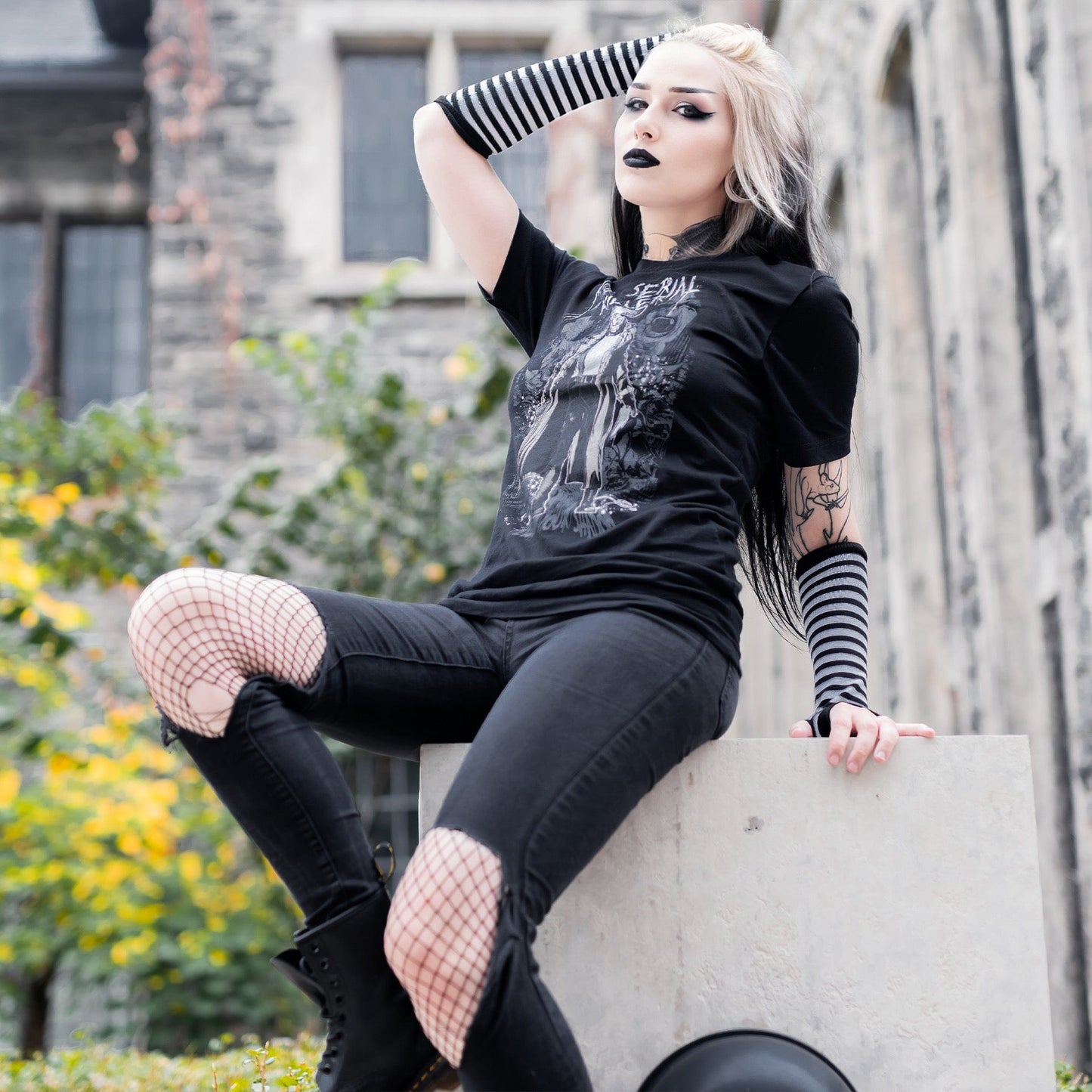 Gothic model wearing the Mr. Serial Killer Follow Your Shadow Graphic T-Shirt in a Victorian setting, capturing dark macabre fashion