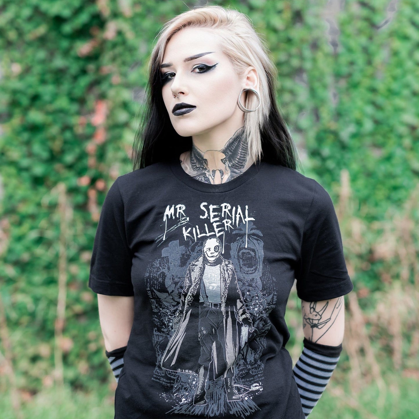 Gothic model wearing the Mr. Serial Killer Follow Your Shadow Graphic T-Shirt in a Victorian setting, capturing dark macabre fashion