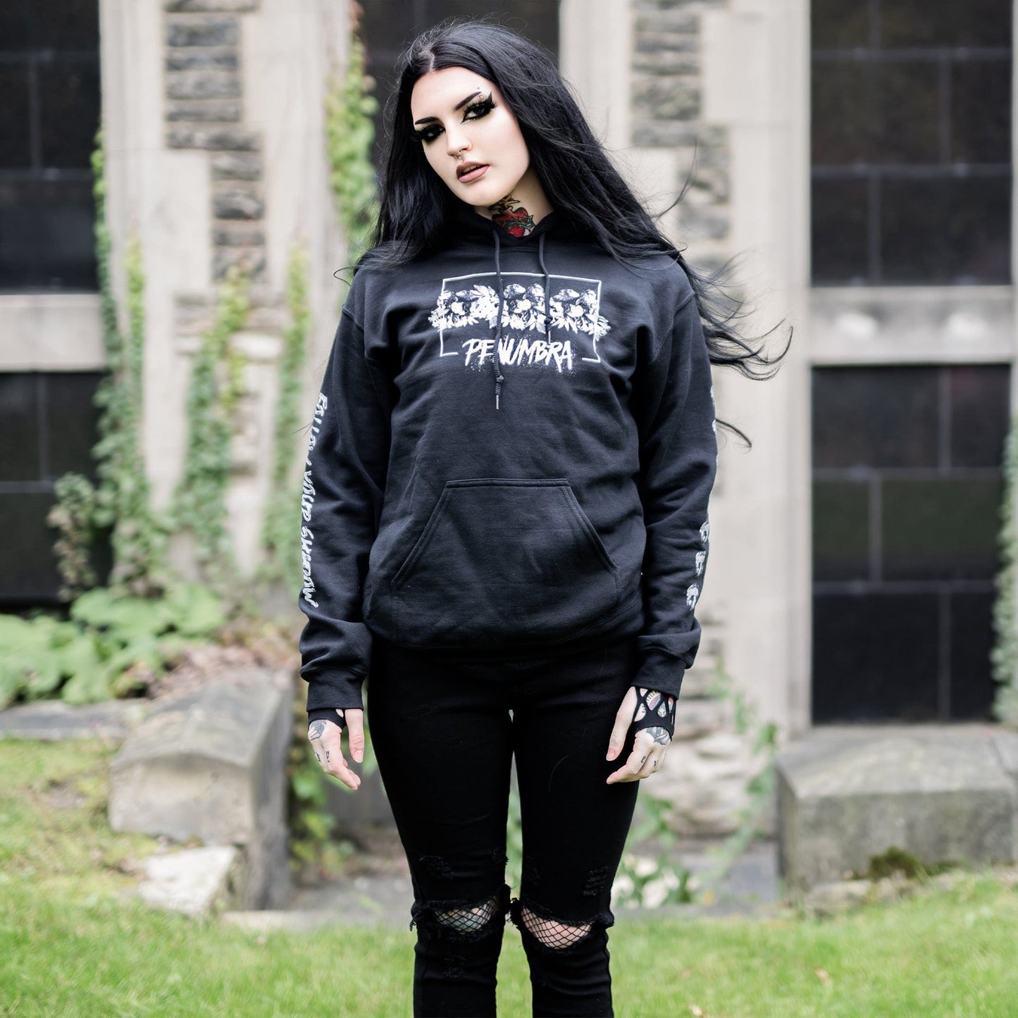 Gothic model wearing the Penumbra Black Hoodie in a Victorian setting, capturing the essence of dark macabre fashion.