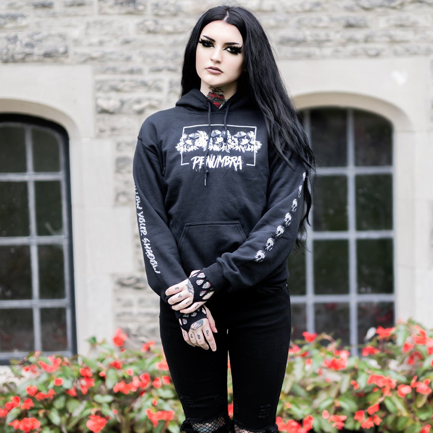Gothic model wearing the Penumbra Black Hoodie in a Victorian setting, capturing the essence of dark macabre fashion.