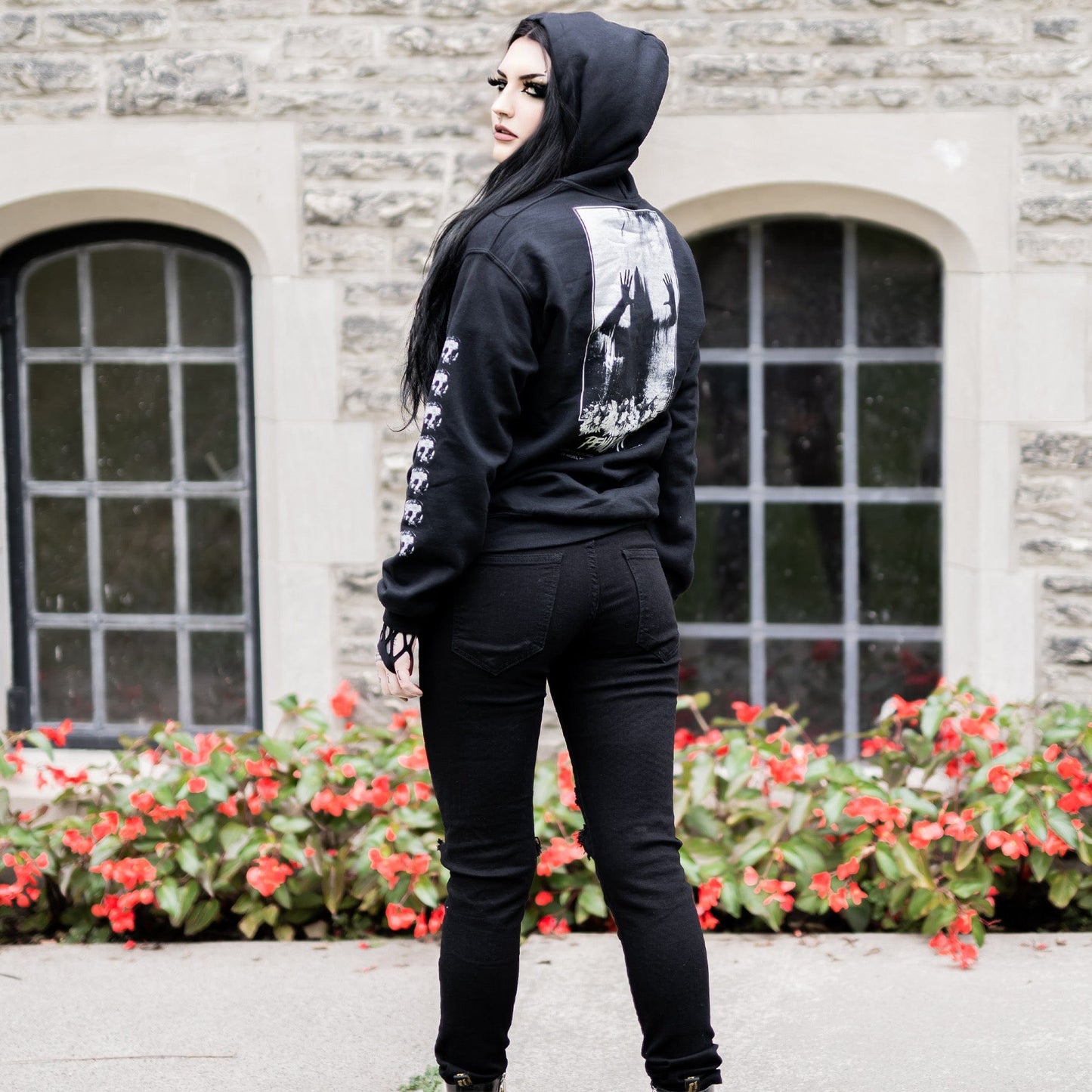 Gothic model wearing the Penumbra Black Hoodie in a Victorian setting, capturing the essence of dark macabre fashion.