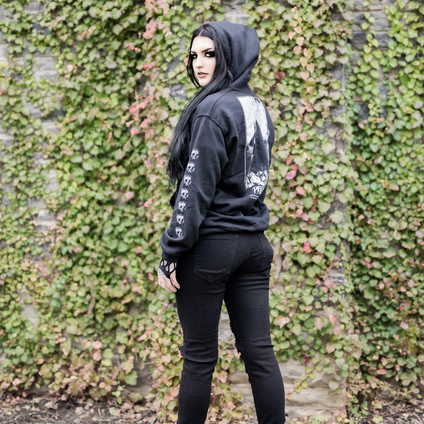 Gothic model wearing the Penumbra Black Hoodie in a Victorian setting, capturing the essence of dark macabre fashion.