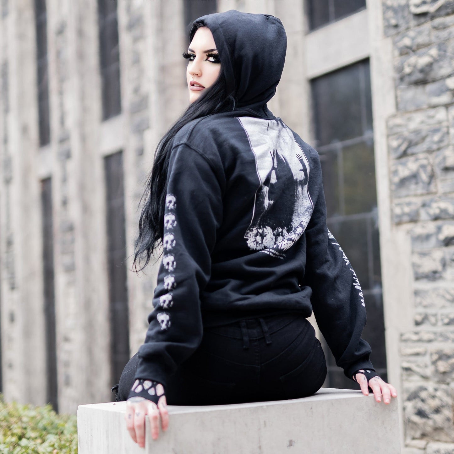 Gothic model wearing the Penumbra Black Hoodie in a Victorian setting, capturing the essence of dark macabre fashion.