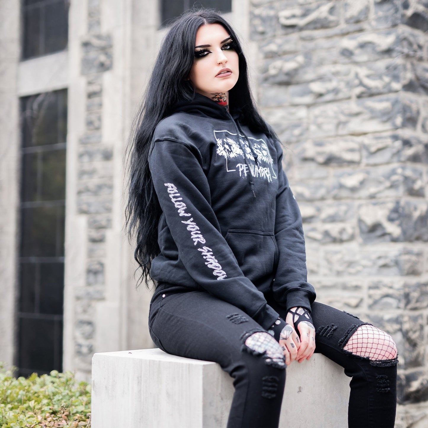 Gothic model wearing the Penumbra Black Hoodie in a Victorian setting, capturing the essence of dark macabre fashion.