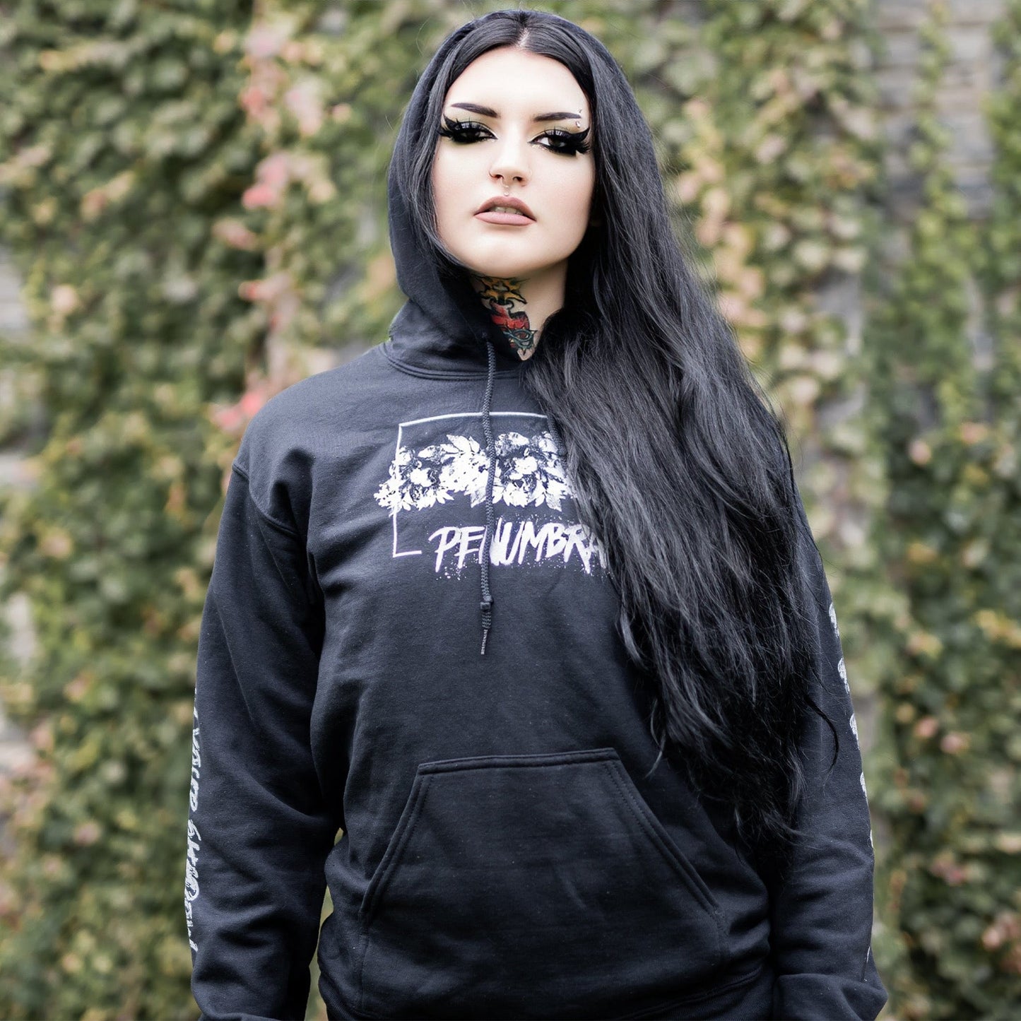 Gothic model wearing the Penumbra Black Hoodie in a Victorian setting, capturing the essence of dark macabre fashion.