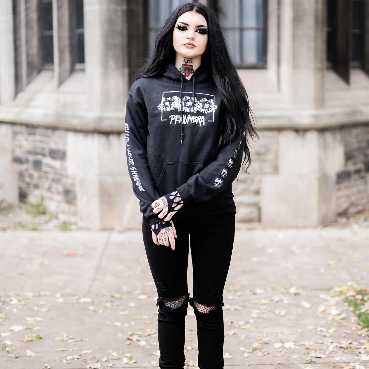 Gothic model wearing the Penumbra Black Hoodie in a Victorian setting, capturing the essence of dark macabre fashion.