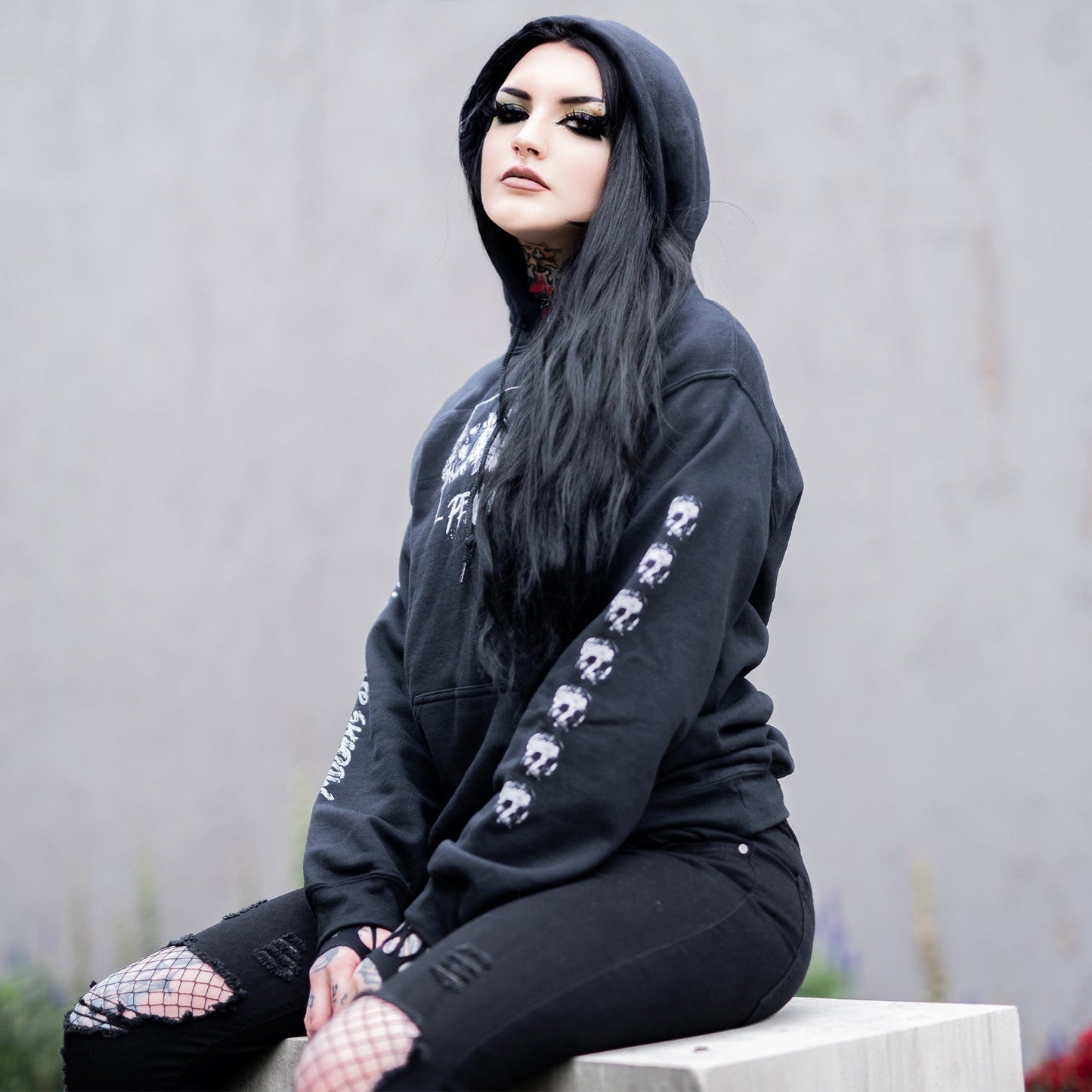 Gothic model wearing the Penumbra Black Hoodie in a Victorian setting, capturing the essence of dark macabre fashion.