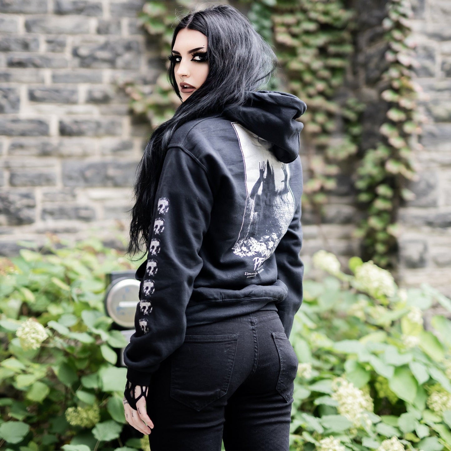 Gothic model wearing the Penumbra Black Hoodie in a Victorian setting, capturing the essence of dark macabre fashion.