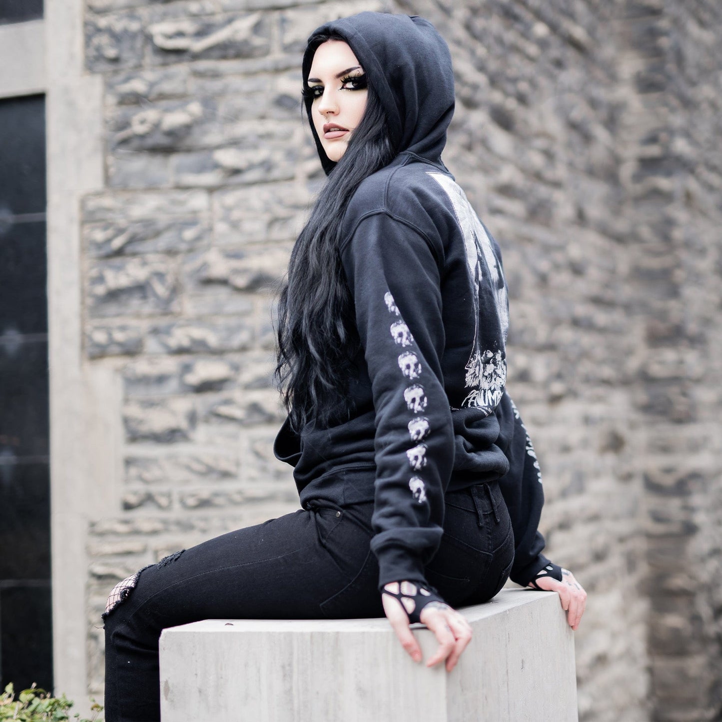 Gothic model wearing the Penumbra Black Hoodie in a Victorian setting, capturing the essence of dark macabre fashion.