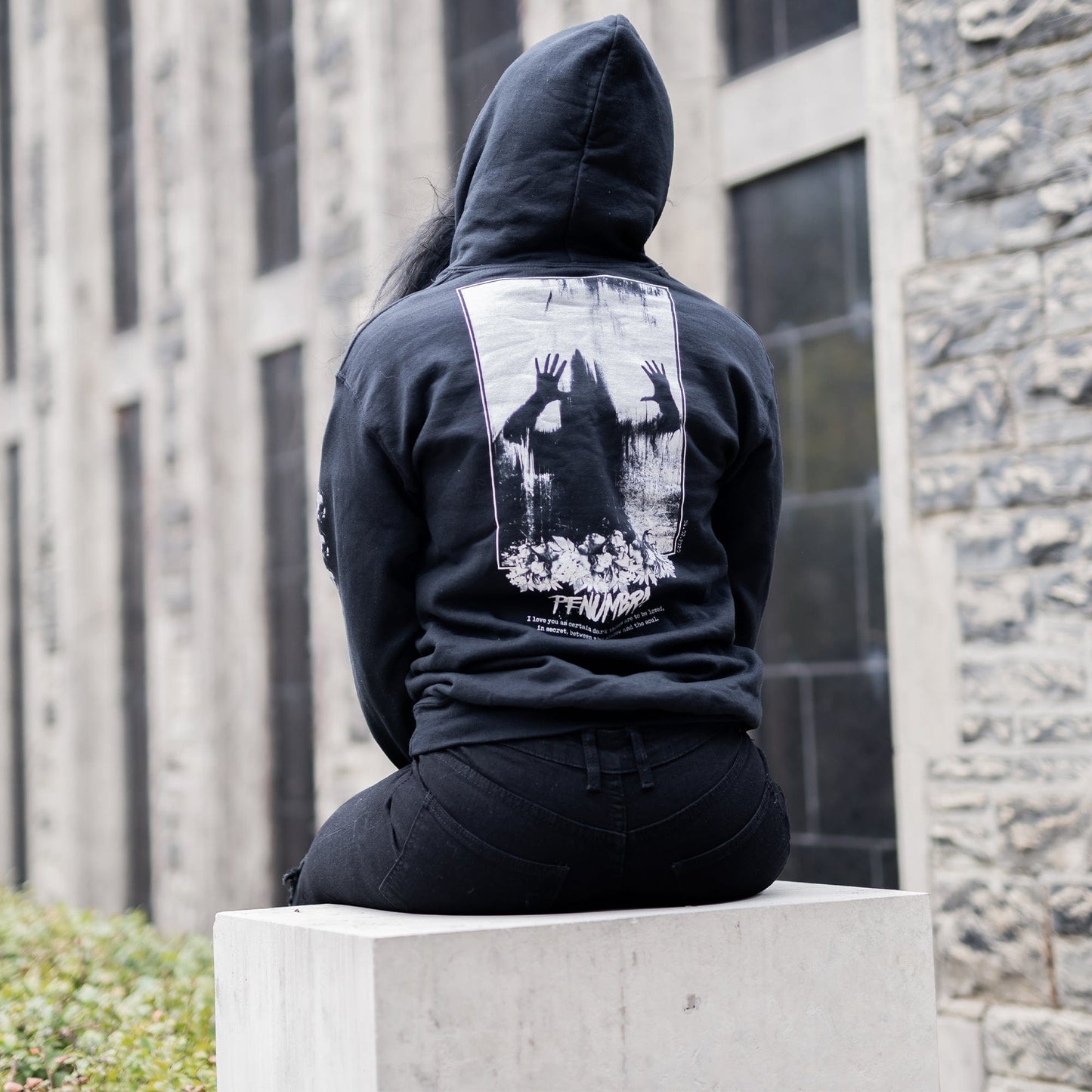 Gothic model wearing the Penumbra Black Hoodie in a Victorian setting, capturing the essence of dark macabre fashion.