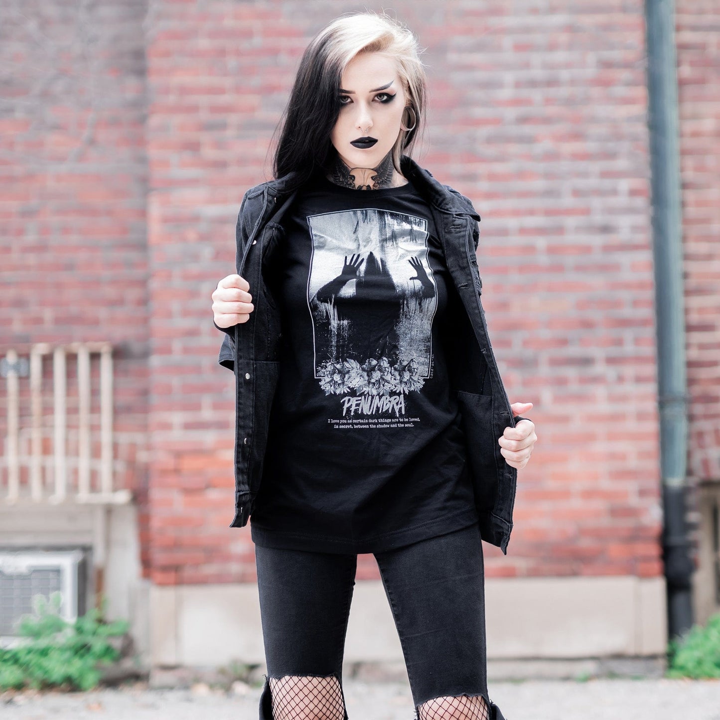 Gothic model wearing the Penumbra Graphic T-Shirt in a Victorian setting, capturing the essence of dark macabre fashion.