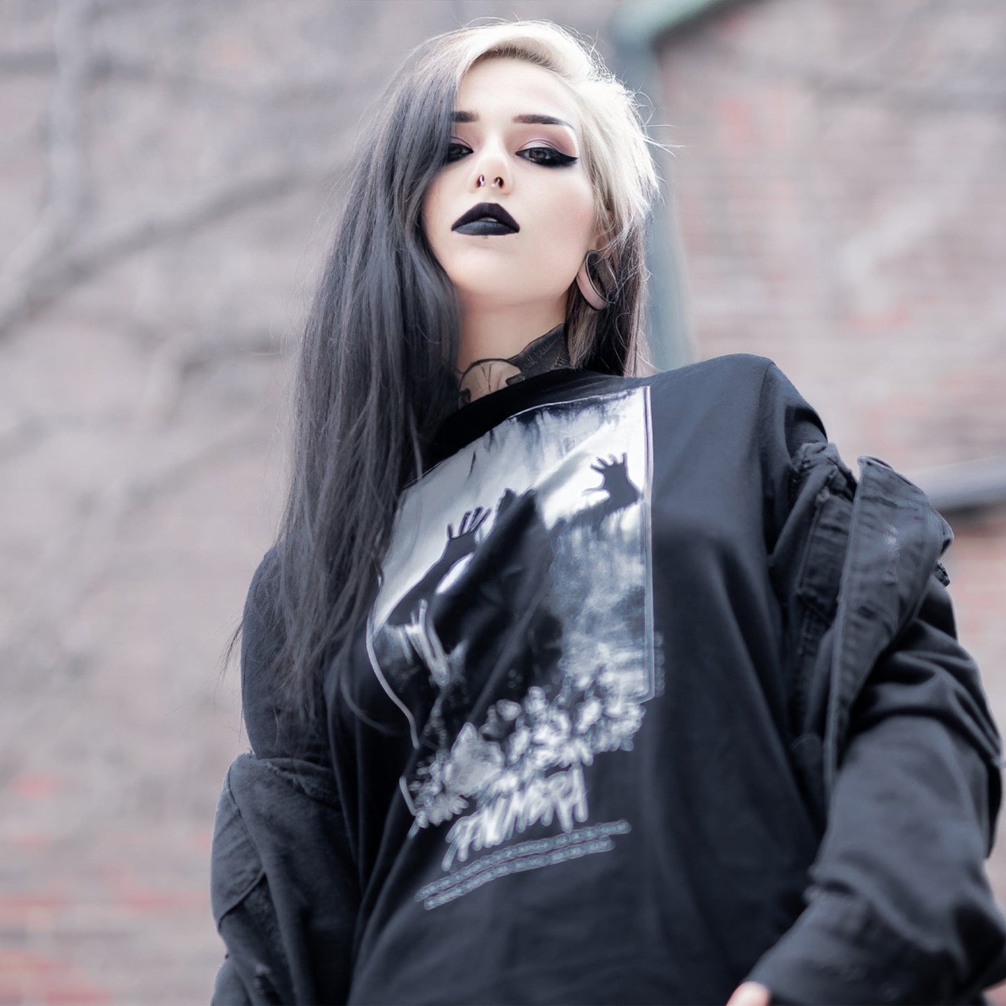 Gothic model wearing the Penumbra Graphic T-Shirt in a Victorian setting, capturing the essence of dark macabre fashion.