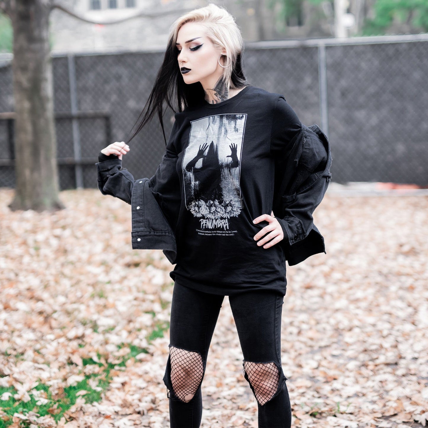 Gothic model wearing the Penumbra Graphic T-Shirt in a Victorian setting, capturing the essence of dark macabre fashion.