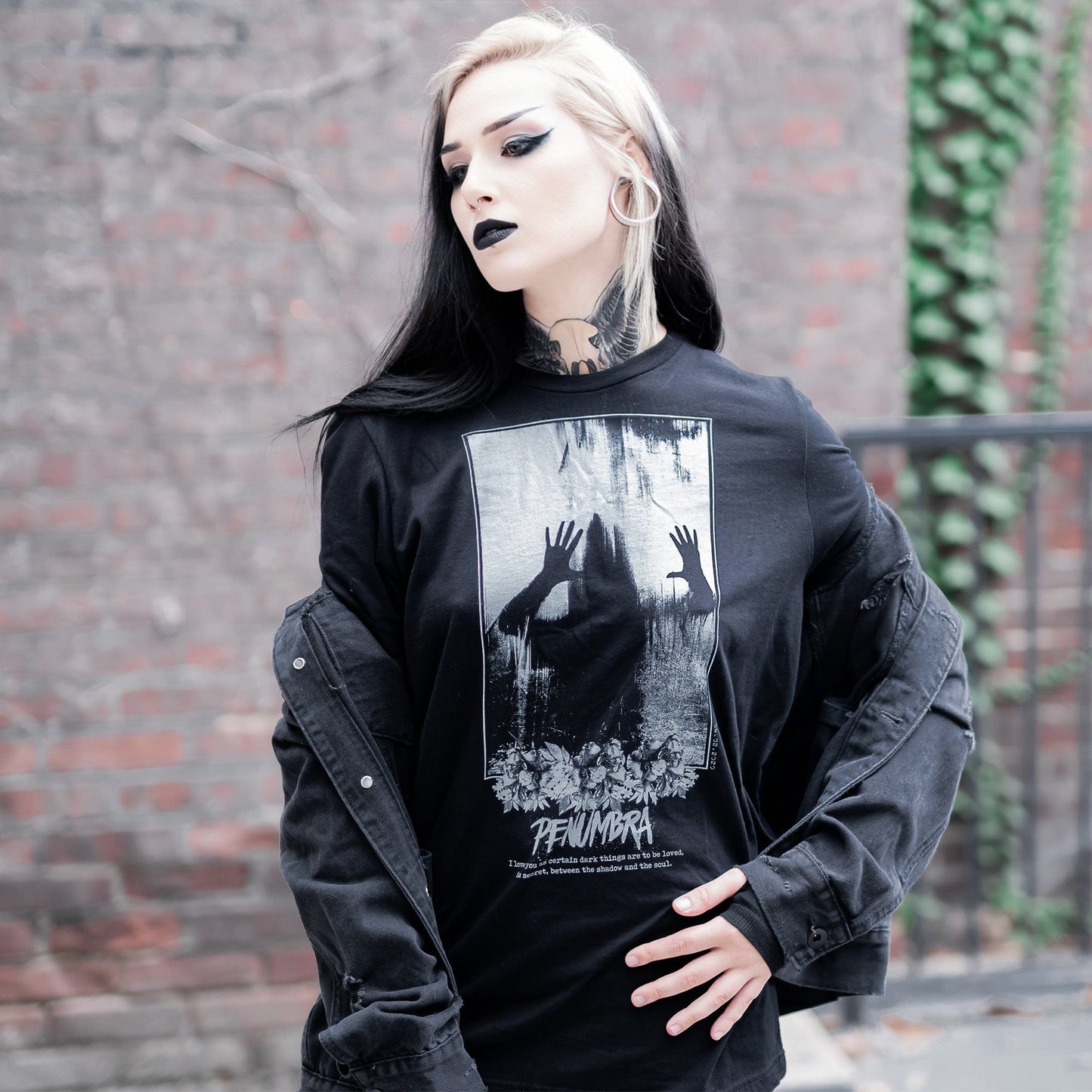 Gothic model wearing the Penumbra Graphic T-Shirt in a Victorian setting, capturing the essence of dark macabre fashion.