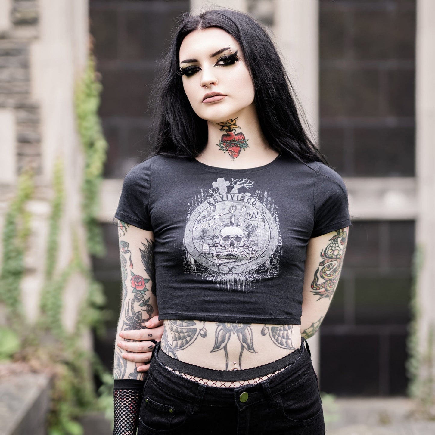 Goth model wearing the Revivisco Graphic Crop Top, showcasing the ancient sigil design and dark aesthetic appeal.