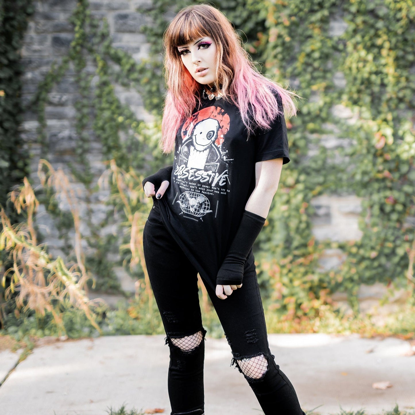 Gothic model wearing the Shadow of the Dark Mage T-Shirt in a Victorian setting, embodying horror and esoteric aesthetics.