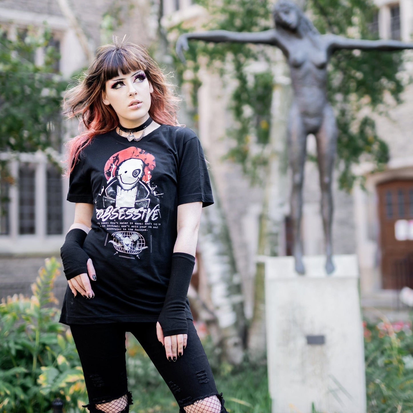 Gothic model wearing the Shadow of the Dark Mage T-Shirt in a Victorian setting, embodying horror and esoteric aesthetics.