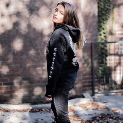 Gothic model wearing the Follow Your Shadow: Mr. Serial Killer Macabre Graphic Black Hoodie in a Victorian setting, embodying dark macabre fashion