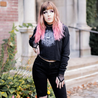 Goth model wearing the Revivisco Graphic Crop Hoodie, showcasing the ancient sigil design and dark aesthetic appeal.