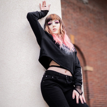 Goth model wearing the Revivisco Graphic Crop Hoodie, showcasing the ancient sigil design and dark aesthetic appeal.