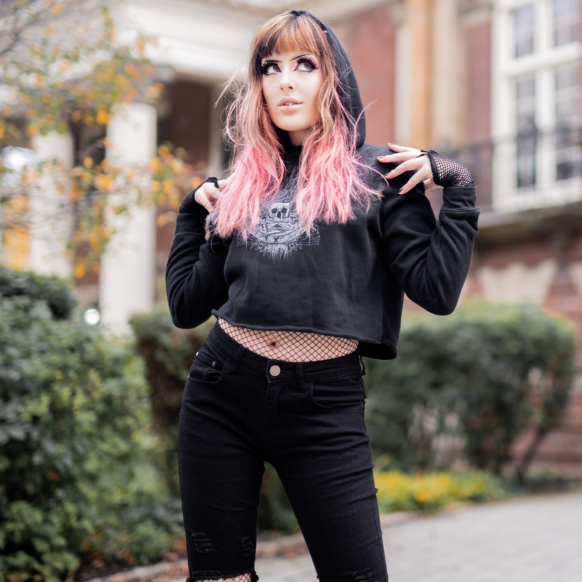 Goth model wearing the Revivisco Graphic Crop Hoodie, showcasing the ancient sigil design and dark aesthetic appeal.