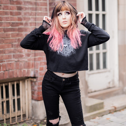 Goth model wearing the Revivisco Graphic Crop Hoodie, showcasing the ancient sigil design and dark aesthetic appeal.