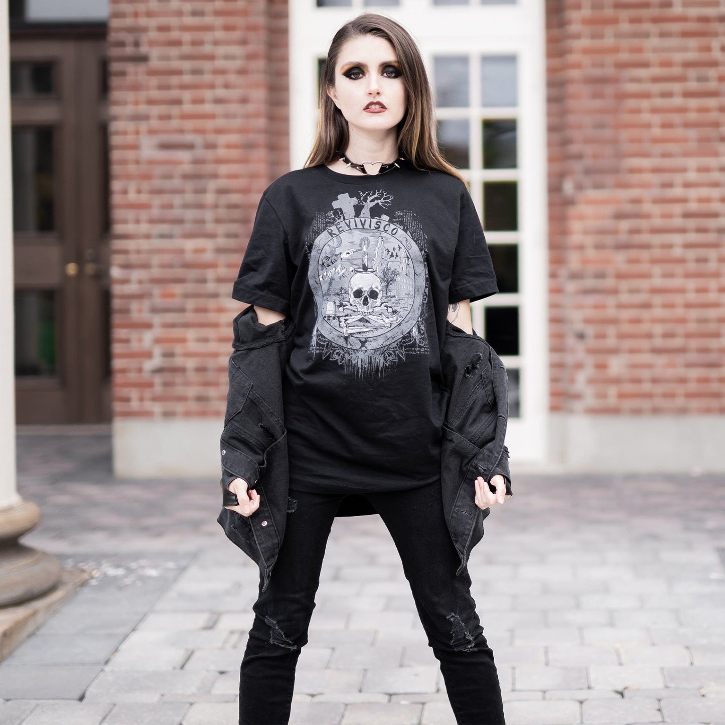 Goth model wearing the Revivisco Graphic T-Shirt, showcasing the ancient sigil design and dark aesthetic appeal.